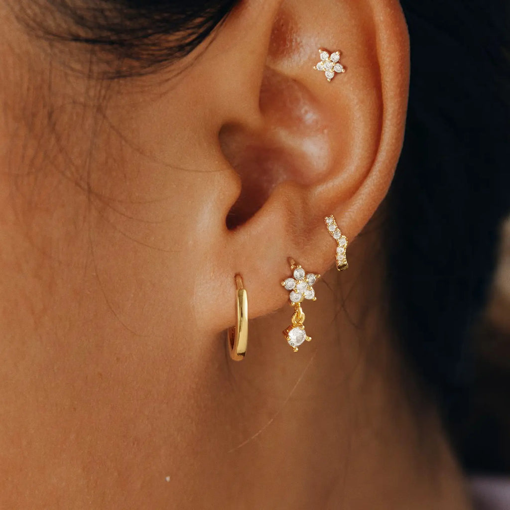 Women wearing gosfry diamond gold hoop earrings